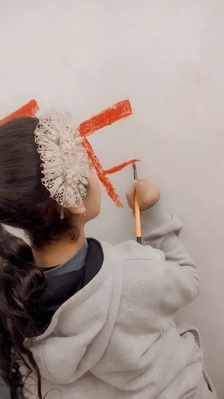 Photograph 5 from: Teaching young children to replace random scribbling with decorating the wall with attract